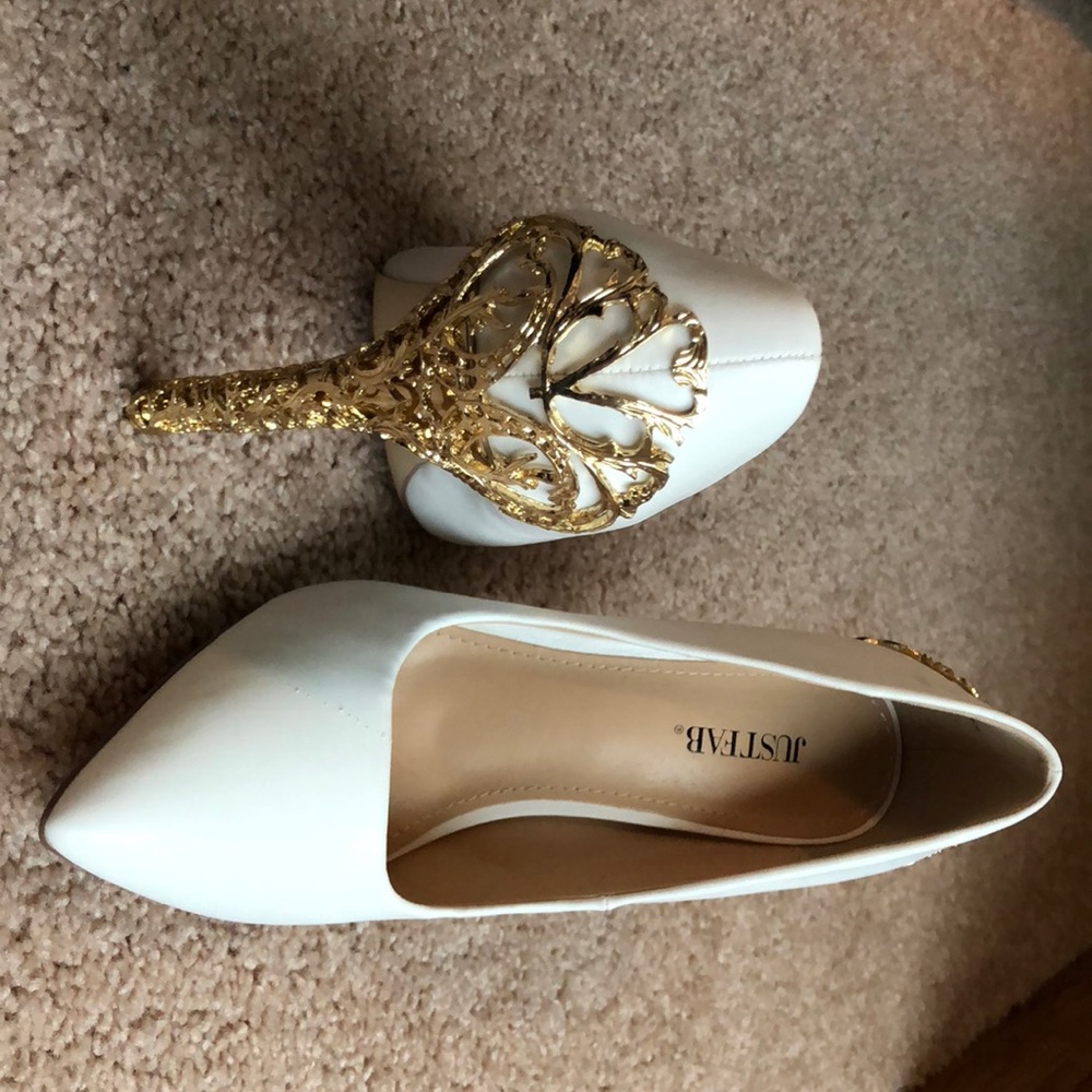 White high heels with gold detailing